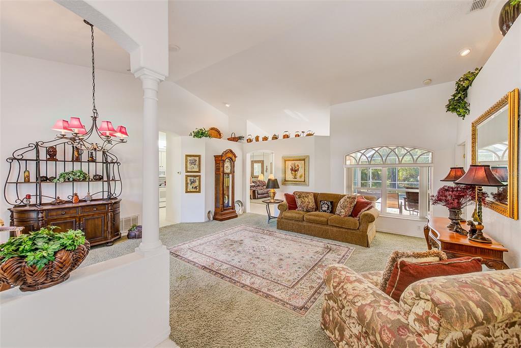 4 Poppy Court Homosassa, FL 34446 - Photo 7 of 55 a living room with furniture and a chandelier