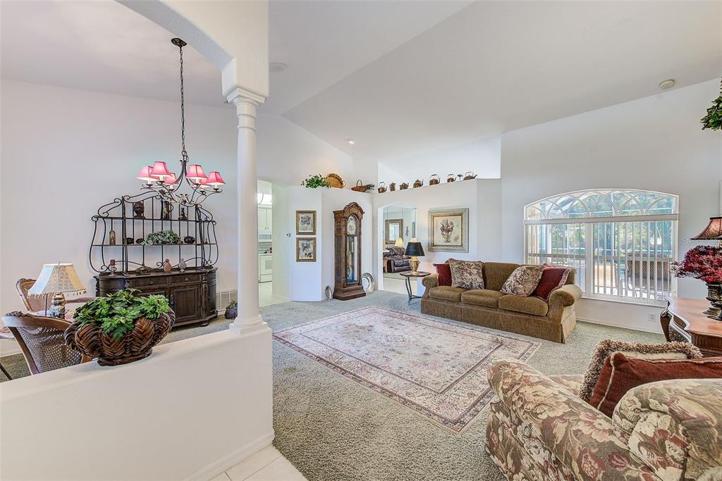 4 Poppy Court Homosassa, FL 34446 - Photo 9 of 55 a living room with furniture and a chandelier