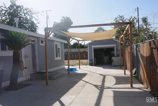 a white toilet sitting next to a bath tub and a rug