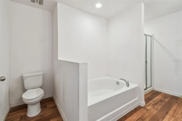 an empty room with closet area