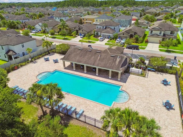 an aerial view of a house with a ocean view