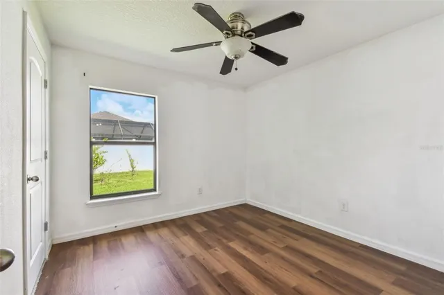 a view of a house with swimming pool and a yard