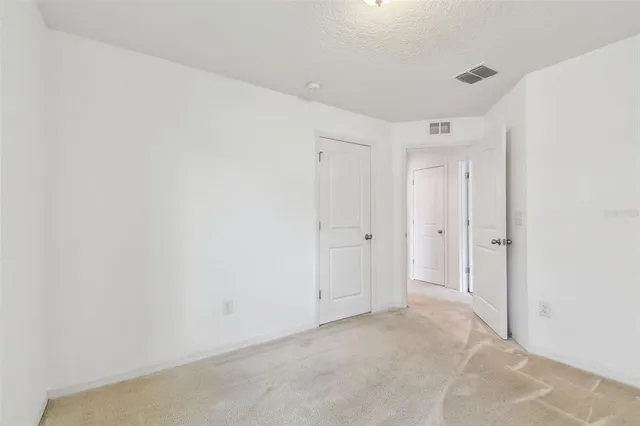 a view of a swimming pool with a yard