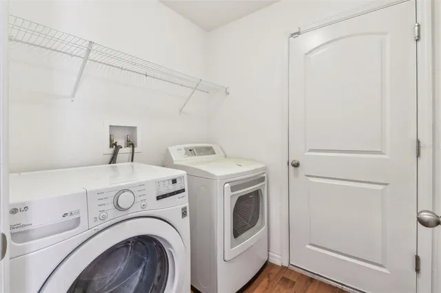 an aerial view of residential houses with outdoor space and swimming pool