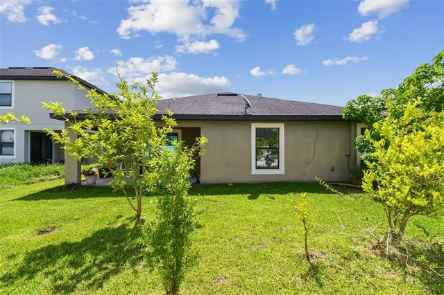 an aerial view of a house with a garden