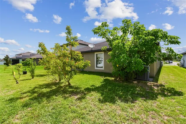 an aerial view of a house with a lake view