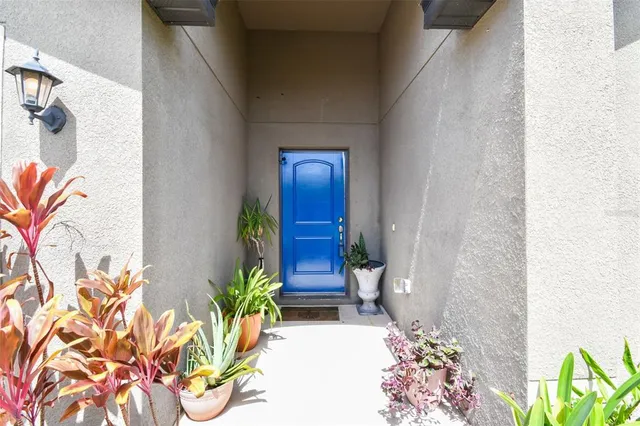 a kitchen with stainless steel appliances granite countertop a sink refrigerator and microwave
