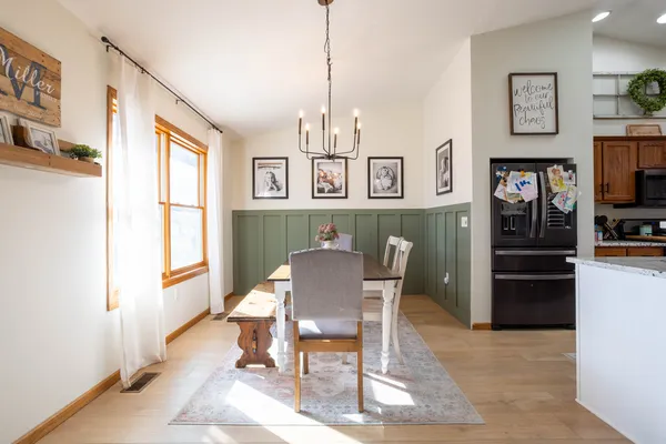 a view of a dining room with furniture window and wooden floor