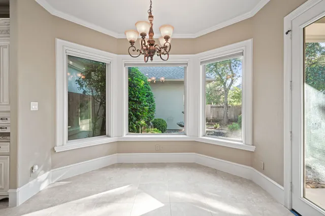 a view of a livingroom with a fireplace and cabinet