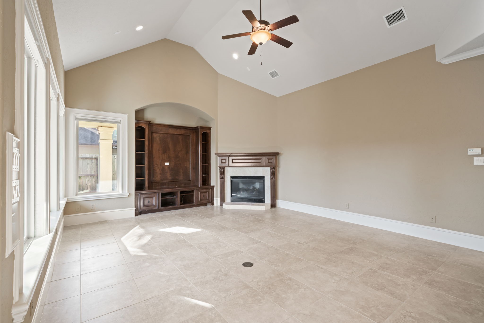 17010 Lapeer Court Spring, TX 77379 - Photo 13 of 36 a view of a livingroom with a fireplace and cabinet