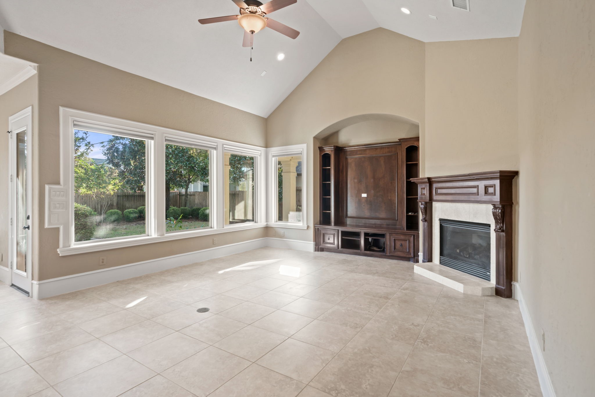 17010 Lapeer Court Spring, TX 77379 - Photo 14 of 36 a view of an empty room with a fireplace and a window