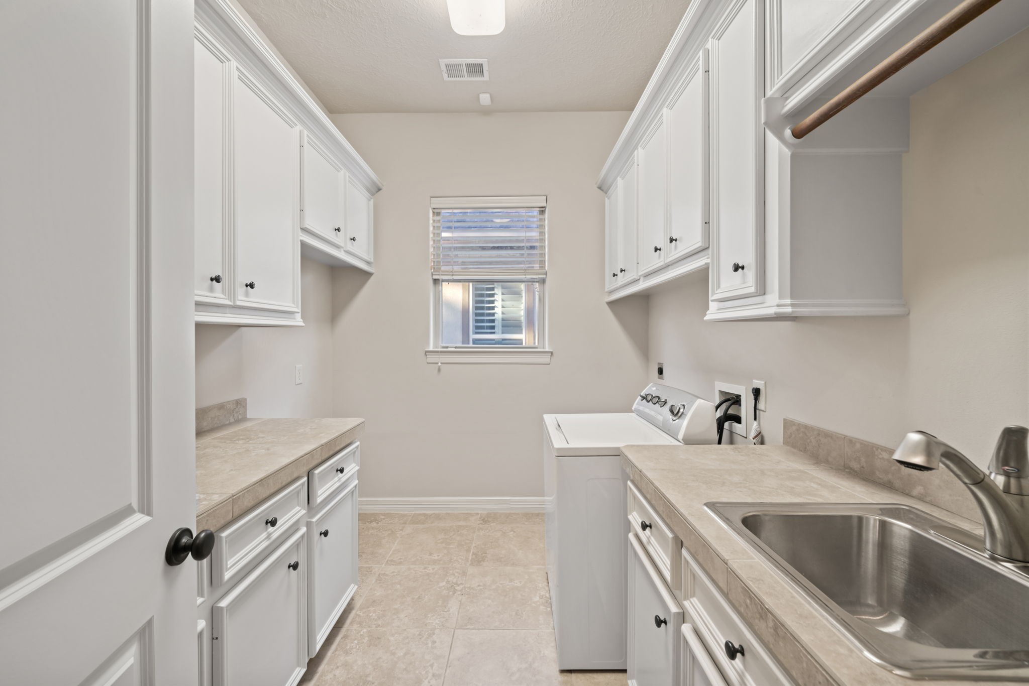 17010 Lapeer Court Spring, TX 77379 - Photo 16 of 36 a kitchen with stainless steel appliances granite countertop a sink stove and cabinets