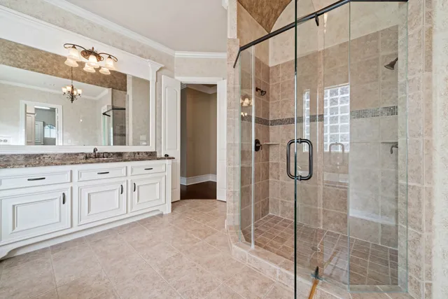 a view of walk in closet with wooden floor