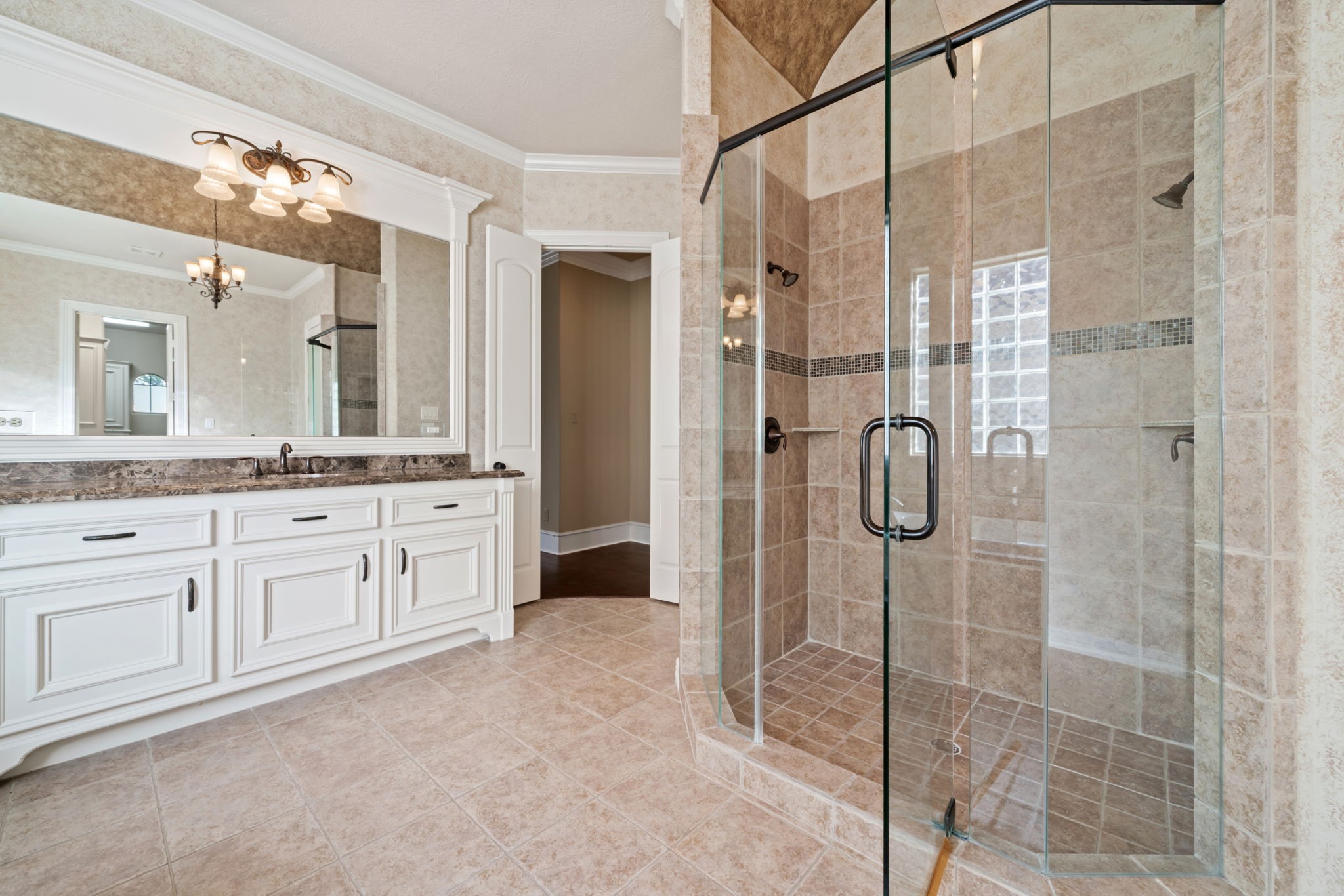 17010 Lapeer Court Spring, TX 77379 - Photo 24 of 36 a bathroom with a granite countertop sink a mirror and a shower