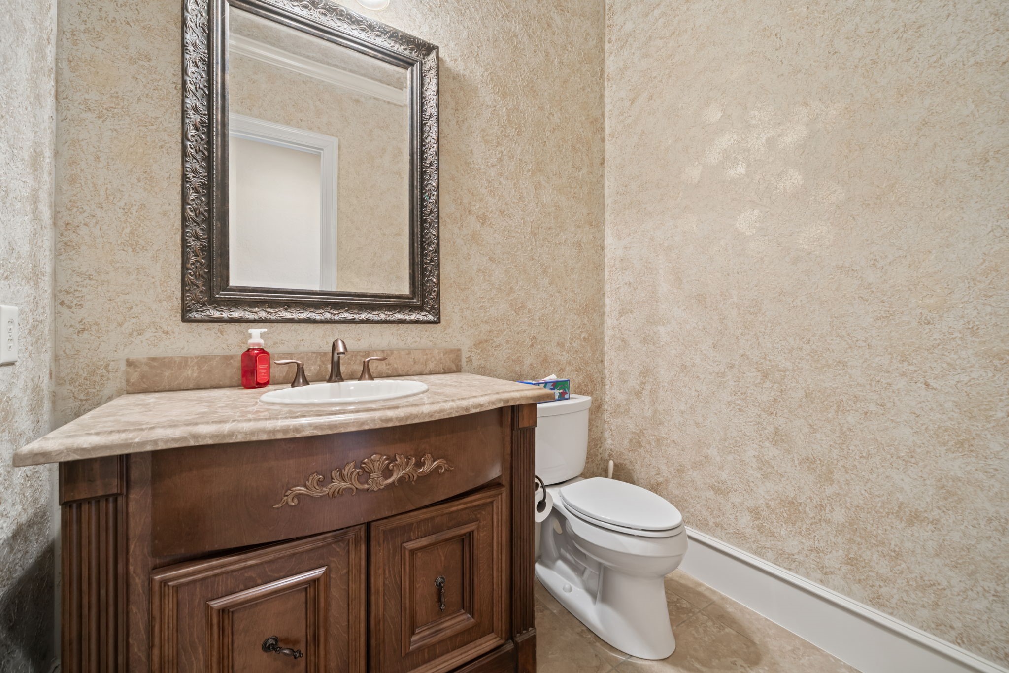 17010 Lapeer Court Spring, TX 77379 - Photo 26 of 36 a bathroom with a granite countertop toilet sink and mirror