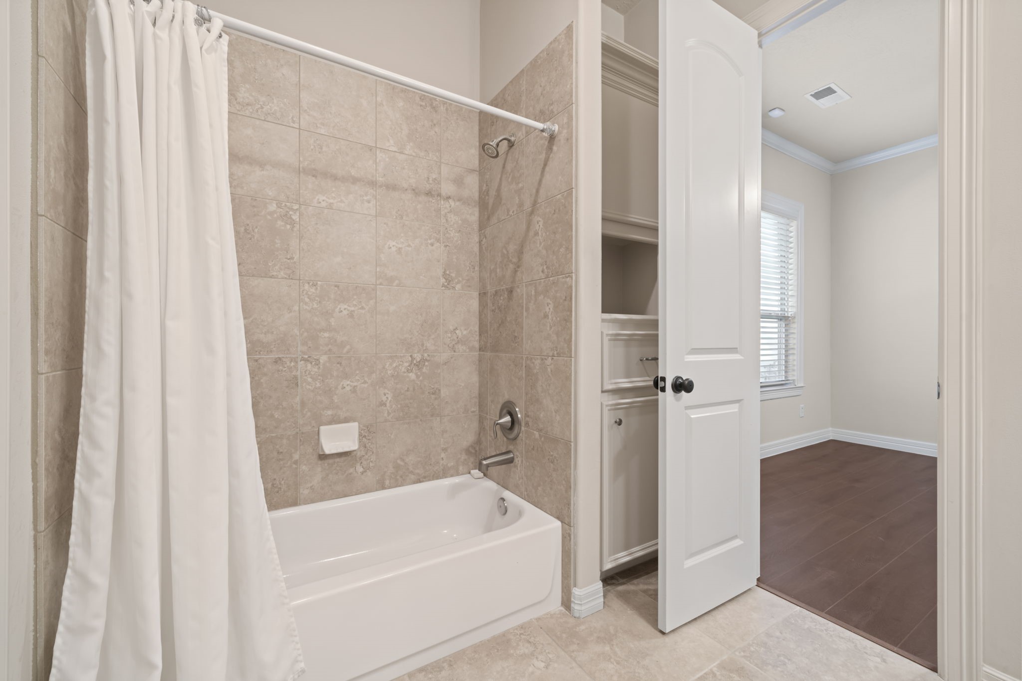 17010 Lapeer Court Spring, TX 77379 - Photo 28 of 36 a bathroom with a bathtub and a shower