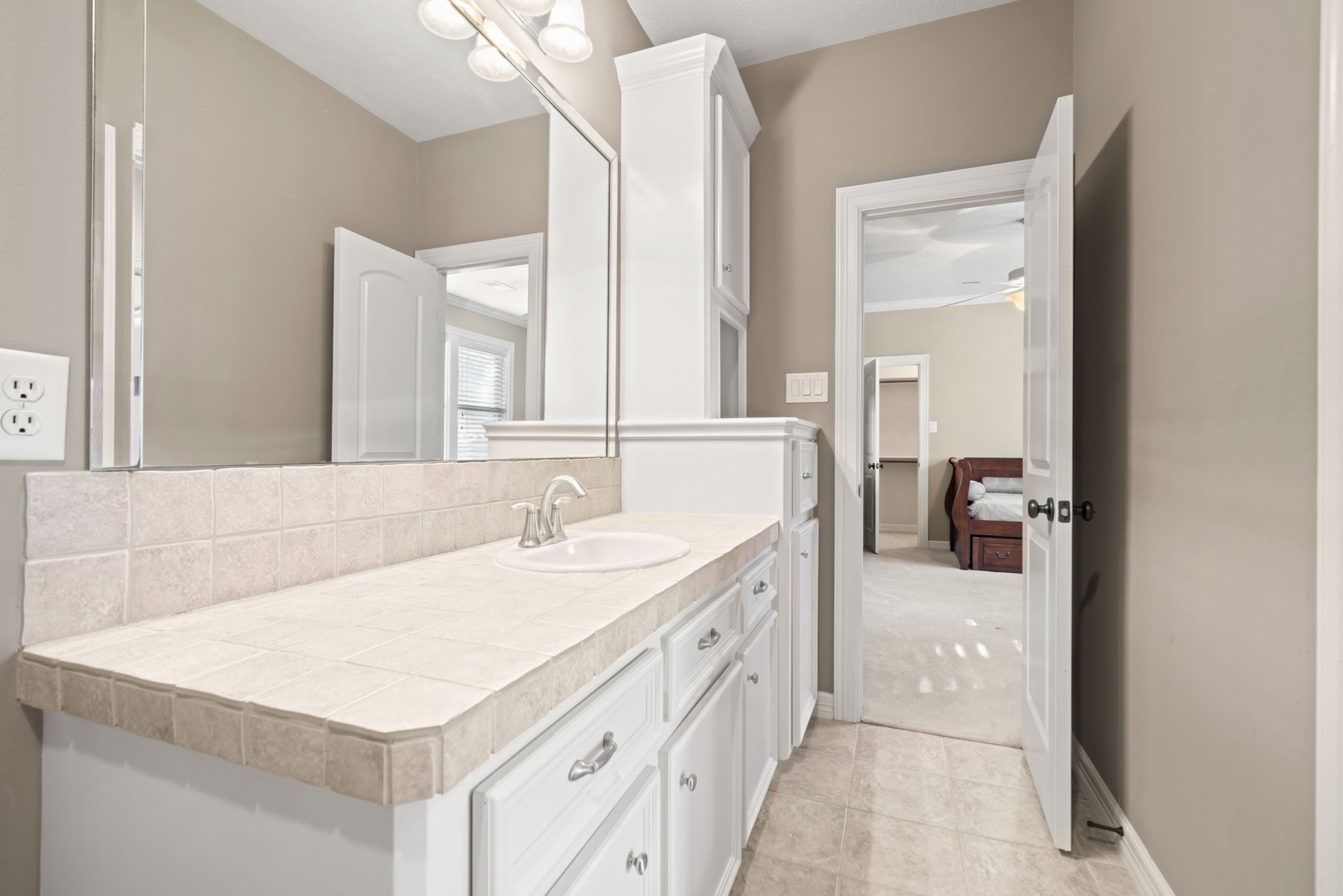 17010 Lapeer Court Spring, TX 77379 - Photo 30 of 36 a bathroom with a sink a vanity and a mirror