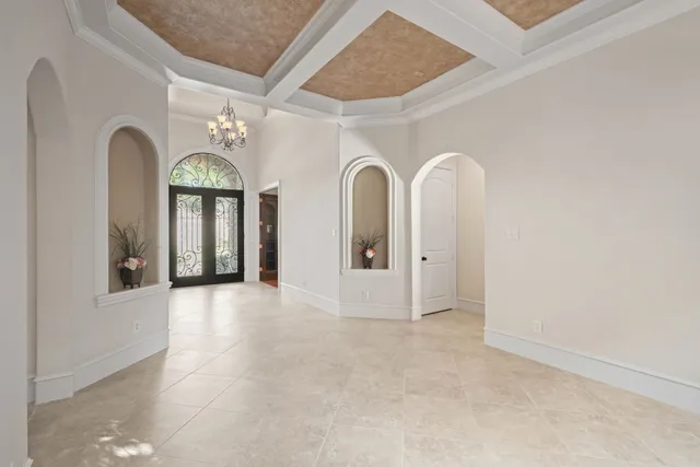a kitchen with counter top space appliances and windows