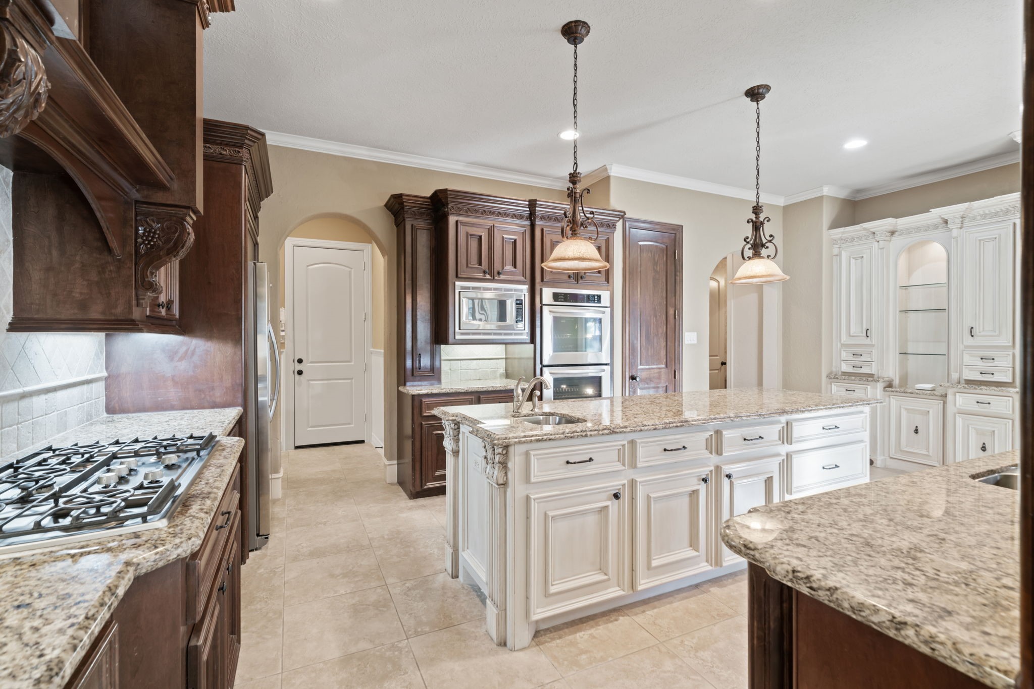 17010 Lapeer Court Spring, TX 77379 - Photo 9 of 36 a kitchen with granite countertop a sink stove and refrigerator