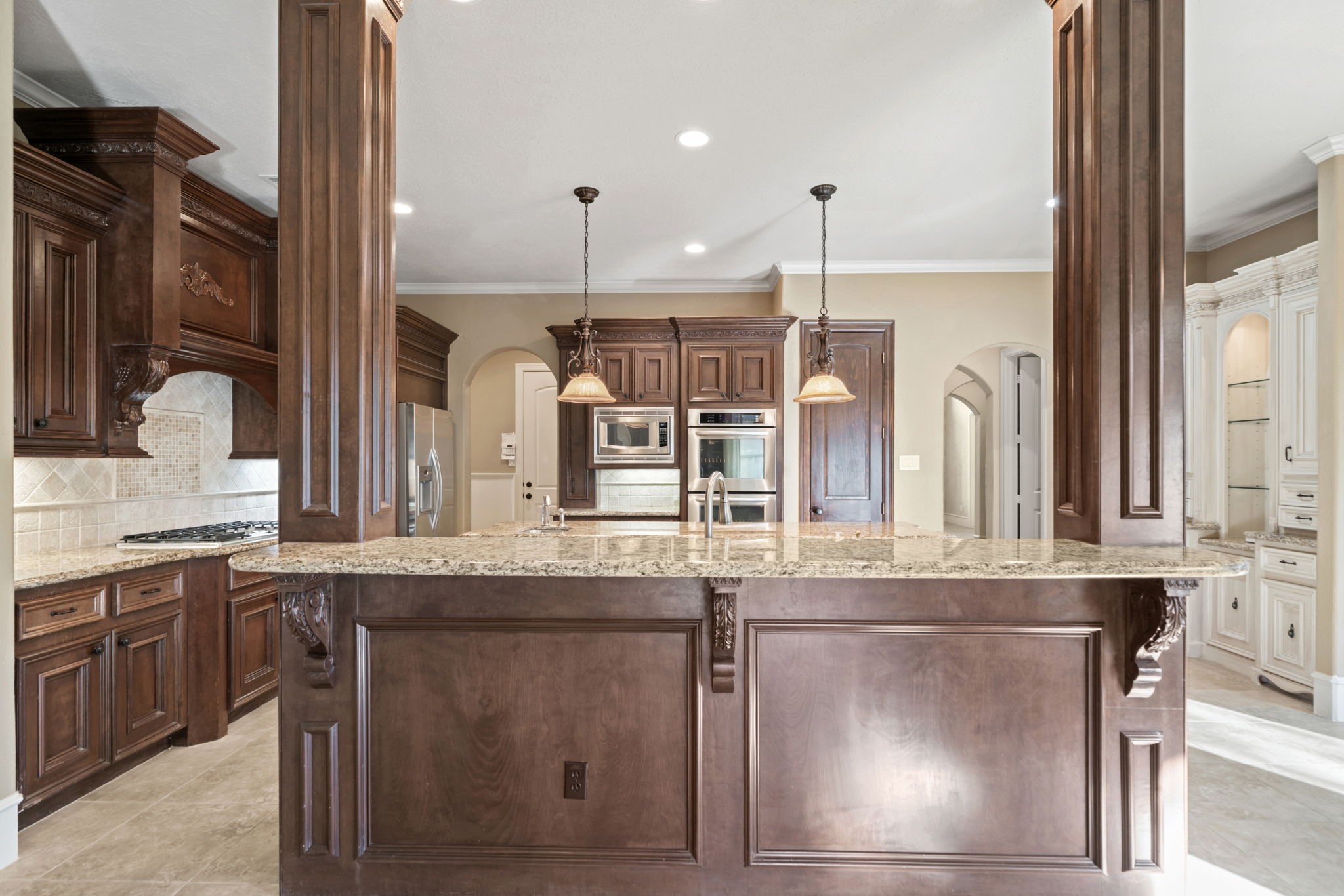 17010 Lapeer Court Spring, TX 77379 - Photo 10 of 36 a kitchen with stainless steel appliances granite countertop a sink and a refrigerator