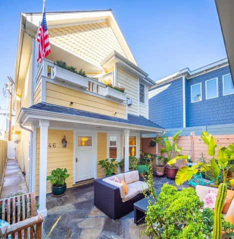 a front view of house with an outdoor seating