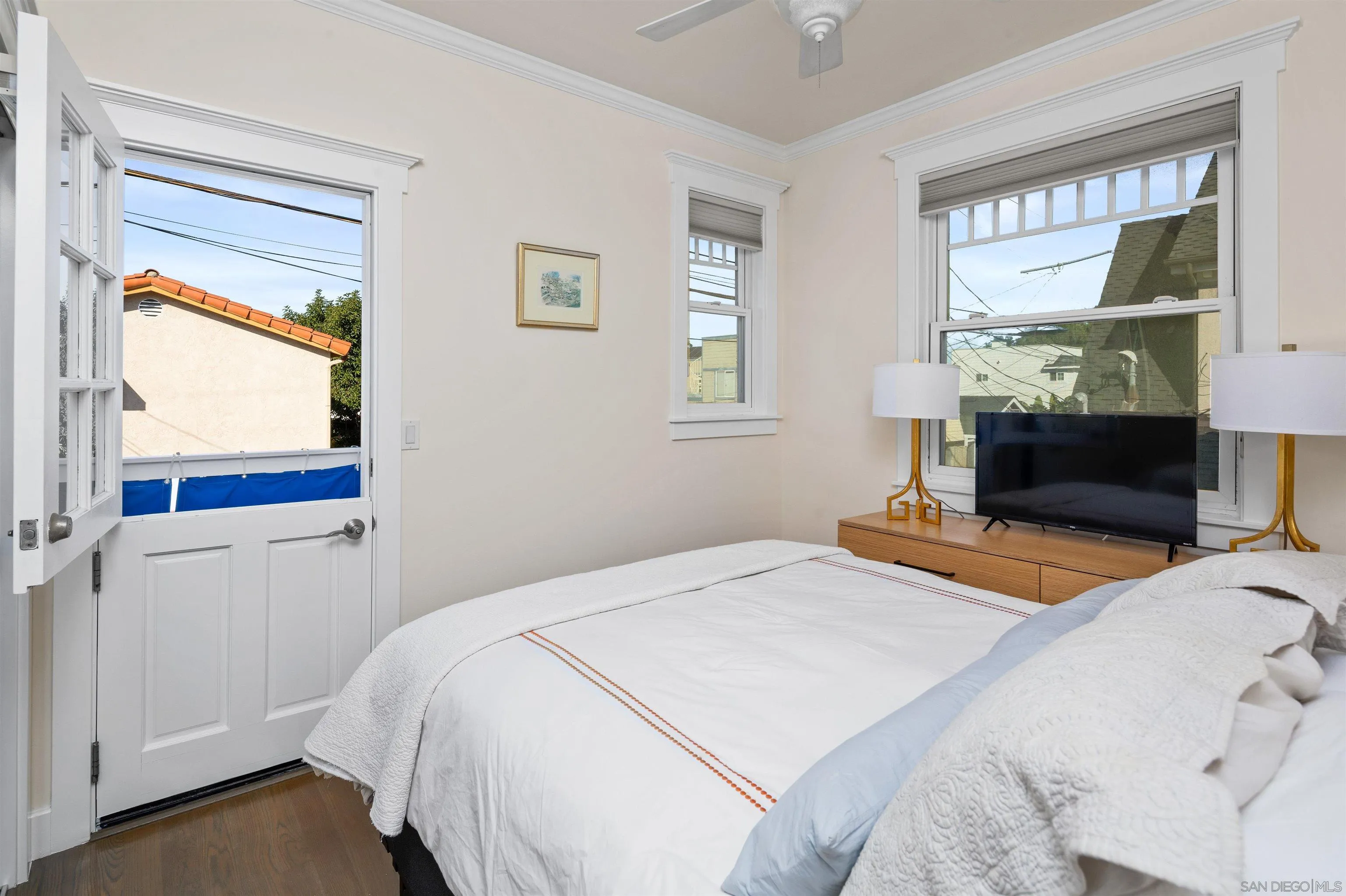 746 G Avenue Coronado, CA 92118 - Photo 25 of 34 a bedroom with a bed and a window