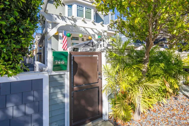 a view of a house with a tree