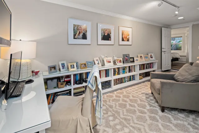 a living room with a couch and a bookshelf