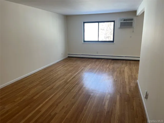 a living room with a fireplace and a fireplace