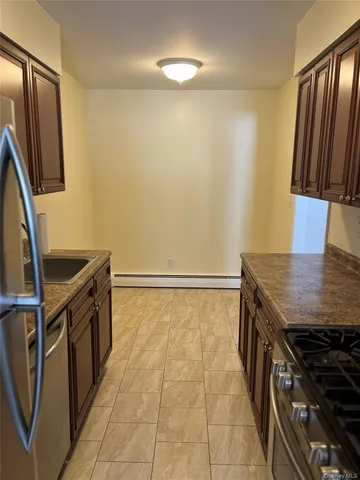 a view of a patio with table and chairs and wooden floor