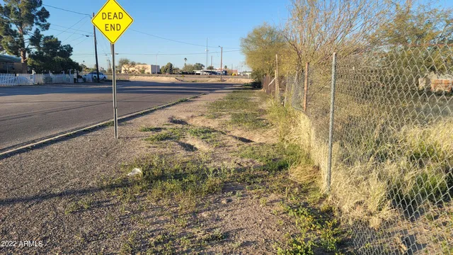 a view of a street with trees