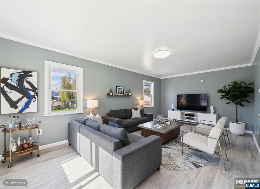 50 Hepburn Road Clifton, NJ 07012 - Photo 2 of 42 a living room with furniture and a flat screen tv