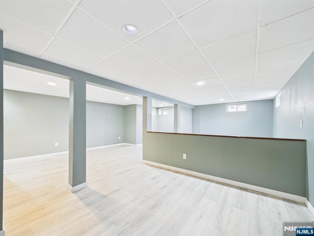 50 Hepburn Road Clifton, NJ 07012 - Photo 21 of 42 an empty room with wooden floor and windows