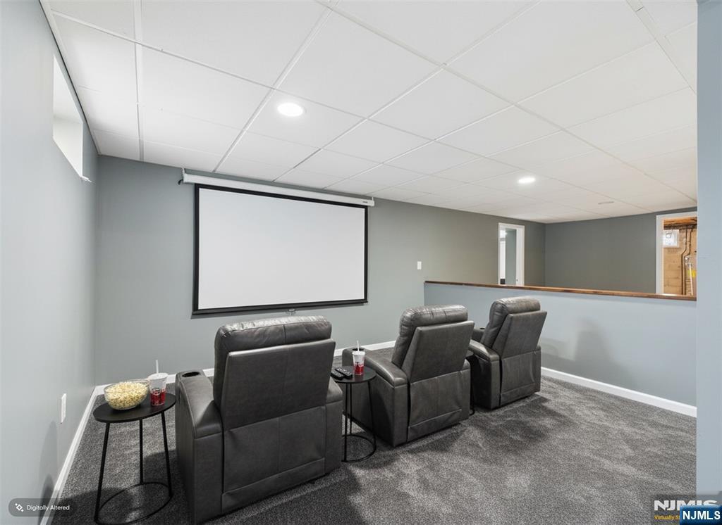 50 Hepburn Road Clifton, NJ 07012 - Photo 3 of 42 a projector room with furniture