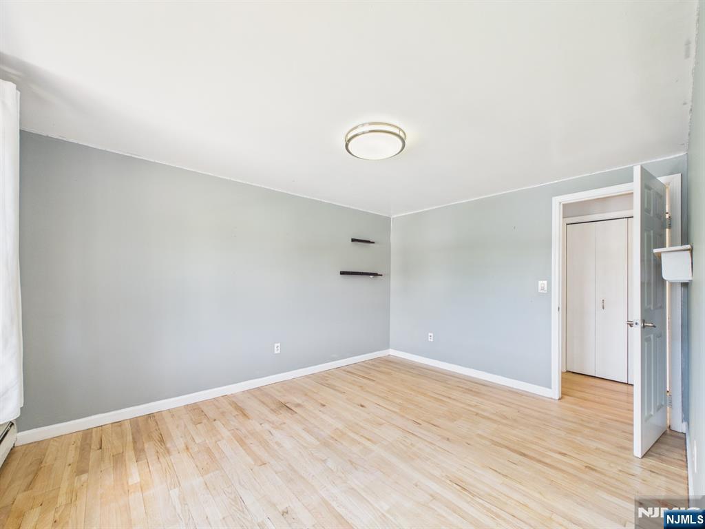 50 Hepburn Road Clifton, NJ 07012 - Photo 31 of 42 a view of empty room with wooden floor