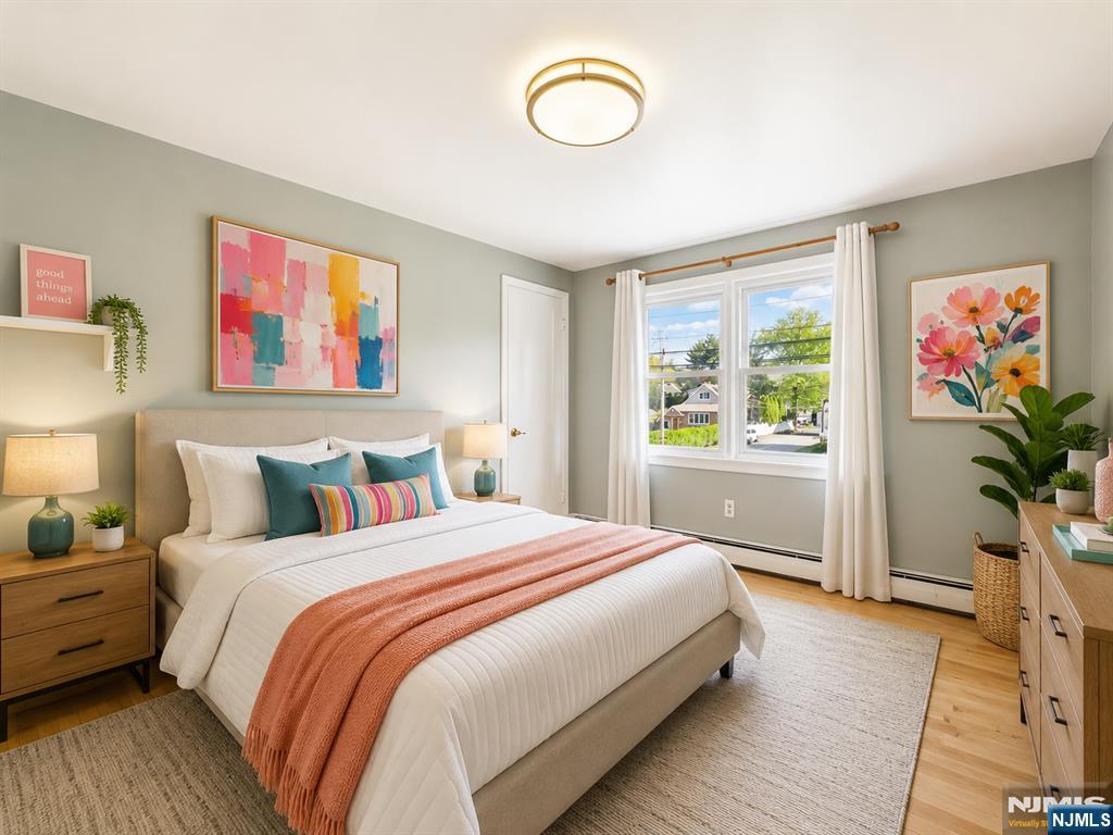 50 Hepburn Road Clifton, NJ 07012 - Photo 5 of 42 a bedroom with a bed and a window
