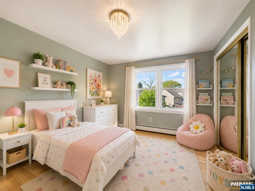 50 Hepburn Road Clifton, NJ 07012 - Photo 7 of 42 a bedroom with a bed and a painting on the wall