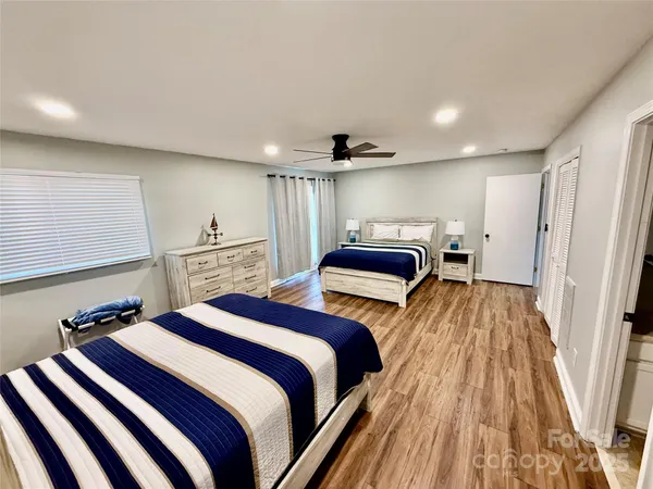 a bedroom with a bed and a walk in closet