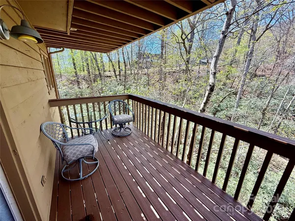 a view of a two chairs on the roof deck