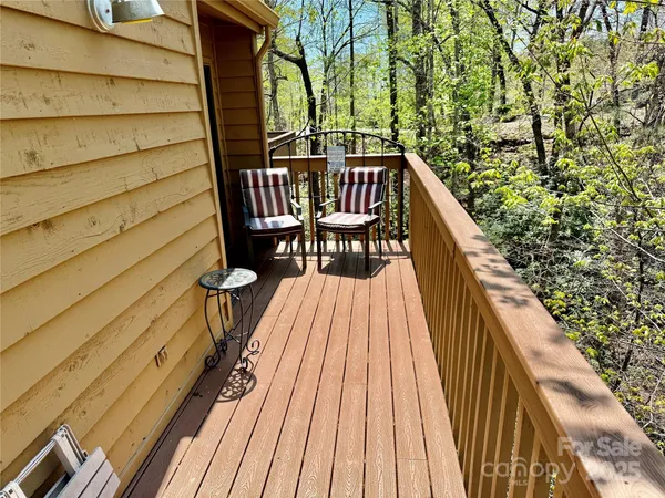 a view of balcony with furniture