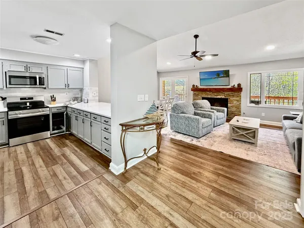 a kitchen with stainless steel appliances granite countertop a stove oven and a refrigerator