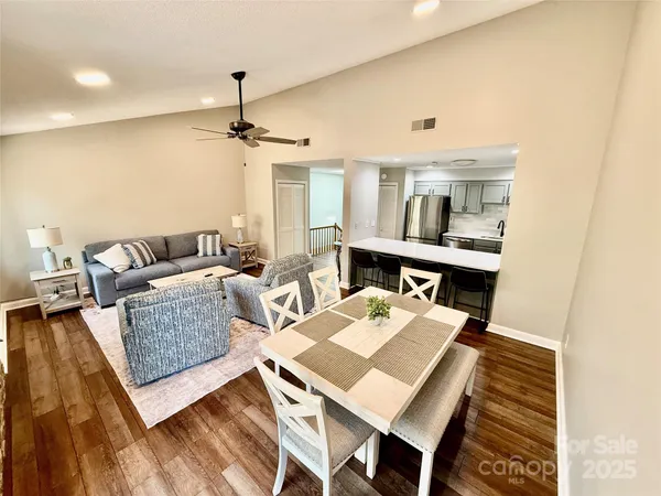 a living room with furniture and a table