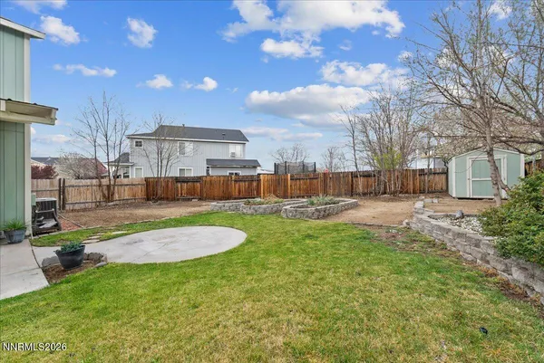 a swimming pool with outdoor seating and yard