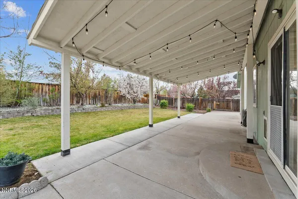 a view of a patio with a backyard