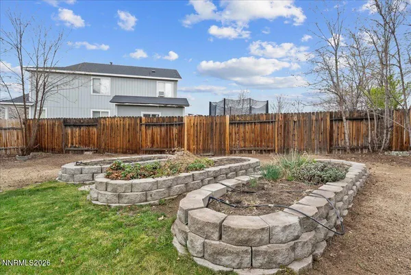a view of a backyard with furniture
