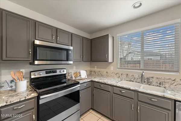 a kitchen with sink cabinets and window