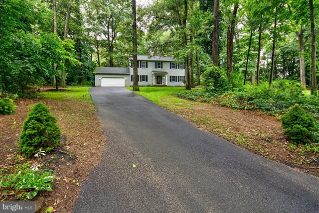 a view of a house with a back yard