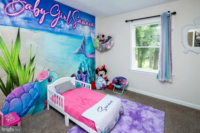 a bed room with furniture and a window