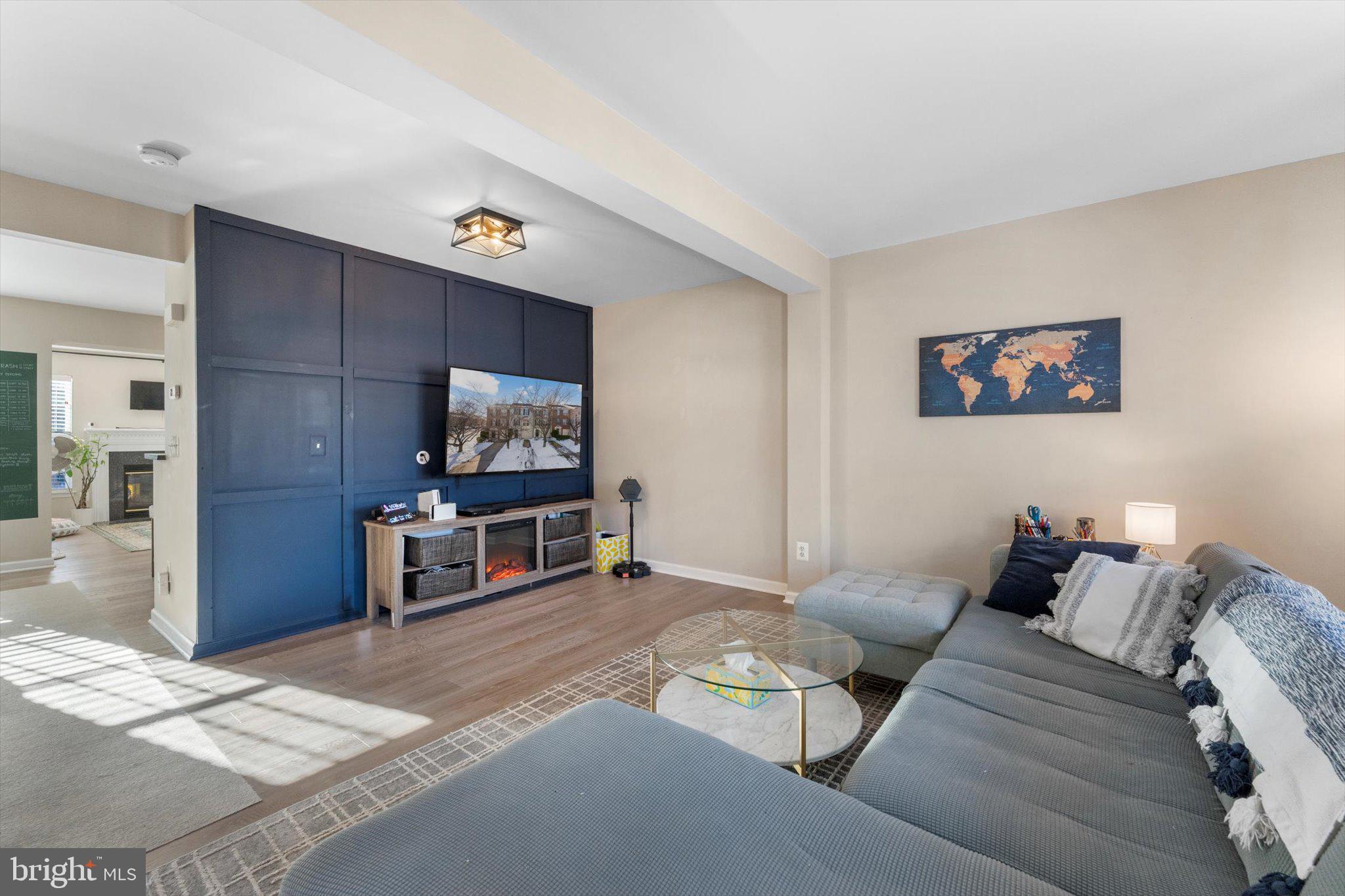 163 Shirley Square Southeast Leesburg, VA 20175 - Photo 20 of 45 a living room with furniture and a flat screen tv