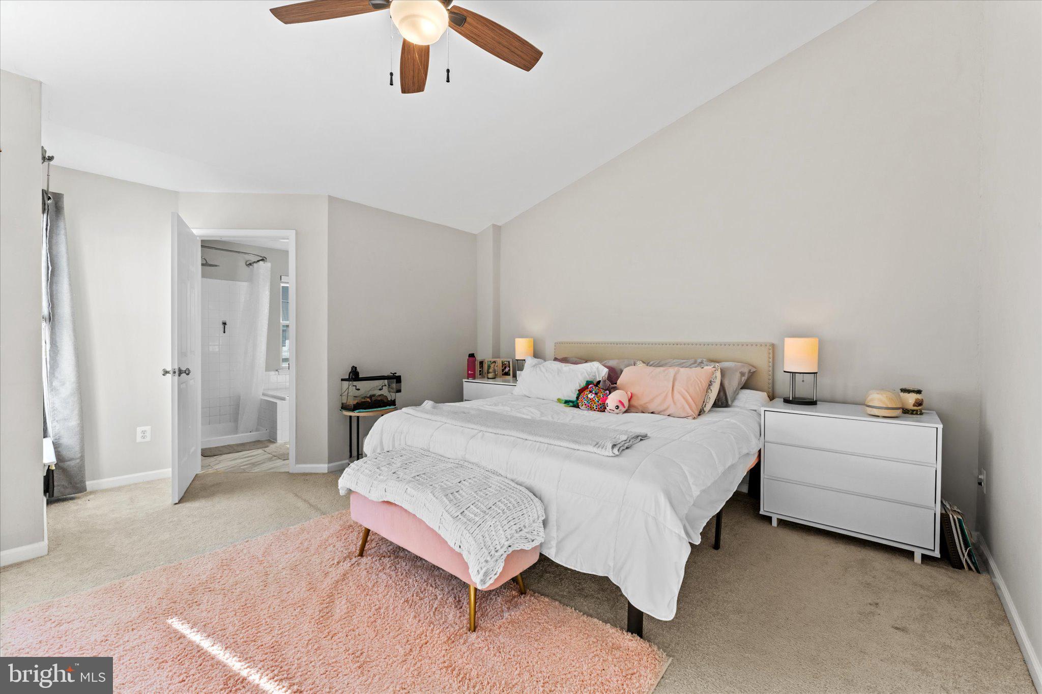 163 Shirley Square Southeast Leesburg, VA 20175 - Photo 24 of 45 a bedroom with a bed and white walls